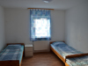 Schlafzimmer mit Einzelbetten - Unterkunft + Mücke